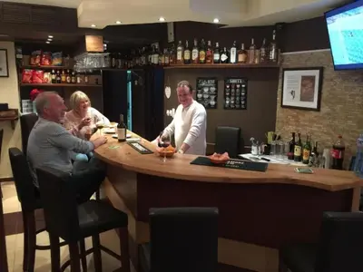 a group of people sitting at a bar at ★ Stylish & Cozy Studios in Valentina Heights Boutique Hotel ★ in Bansko
