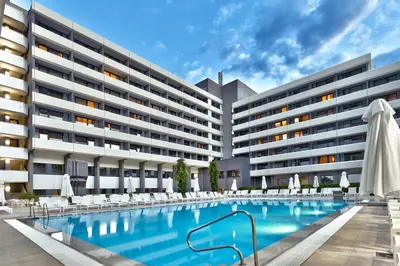 an image of a hotel with a swimming pool at Interhotel Sandanski in Sandanski