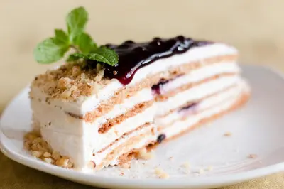 a piece of cake on a white plate at Spa Hotel Orbita in Blagoevgrad