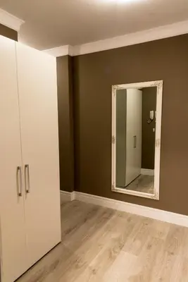 an empty room with a mirror and a closet at Antique Residence in Hisarya