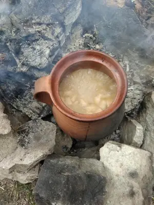 a brown cup sitting on some rocks on the ground at Къща Семково in Semkovo