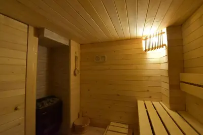 an empty wooden sauna with a bench in it at Къща Семково in Semkovo
