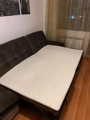a bed on a couch in a room at Belvedere Holiday Club ...VIP ap. in Bansko