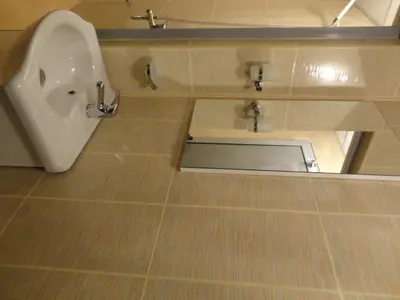 a bathroom with a urinal and a sink at Mountain Dreams Apartment in Sapareva Banya