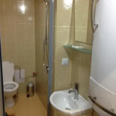 a bathroom with a sink and a toilet at Mountain Dreams Apartment in Sapareva Banya