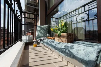 a bench on a balcony with a window at К's City Living with Free Parking in Plovdiv
