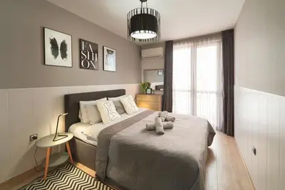 a bedroom with a bed with two teddy bears on it at К's City Living with Free Parking in Plovdiv