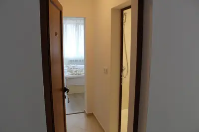 an open door to a room with a bed at Къща за гости Мишурови in Smolyan