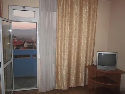 a room with a window with a television at Germanea Hotel in Sapareva Banya