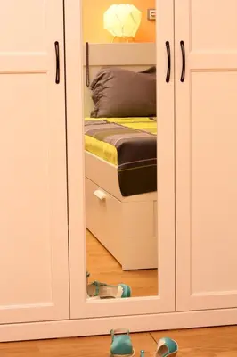 ajar door of a bedroom with a bed inside at Central Charming Home with Garden near Parking and NDK in Sofia