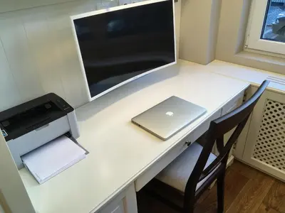 a white desk with a laptop and a printer at A luxury apartment with patio and BBQ in Sofia