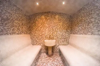a small room with two beds and a sink at Central Point Boutique Hotel in Sofia