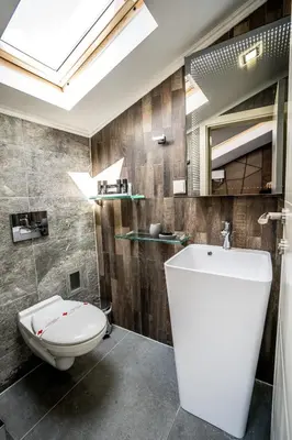 a bathroom with a toilet and a sink at Boutique Guest house 7th Sense in Plovdiv