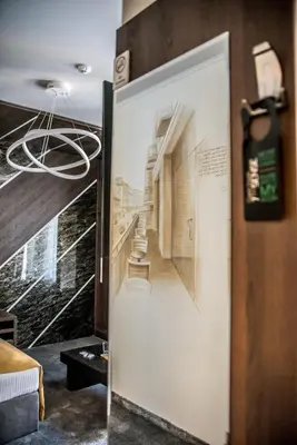a room with a door with a picture of a hallway at Boutique Guest house 7th Sense in Plovdiv