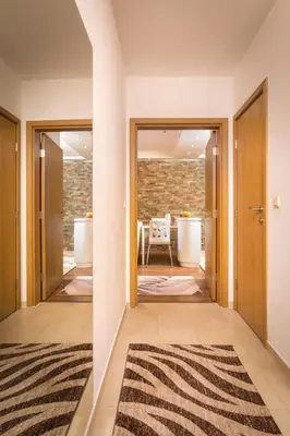 a hallway with a door leading to a living room at Nice and cozy flat in the center in Sofia