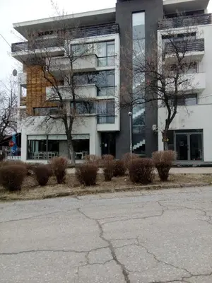 an empty street in front of a building at Студио Бижу in Hisarya