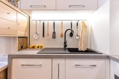 a kitchen with a sink and utensils at The Spot - fully equipped, central, modern studio by Flat Mаnager in Sofia