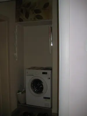 a washer and dryer in a small room at Maria Louisa Apartment in Sofia