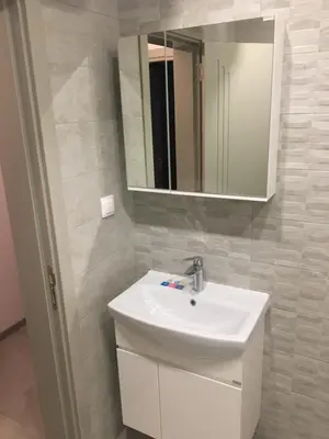 a bathroom with a white sink and a mirror at ApartVel apartment 3 in Velingrad