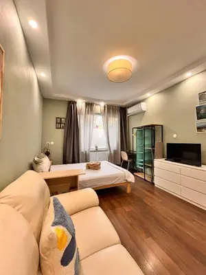 a living room with a bed and a couch at Exceptional Refurnished Studio TOP Location in Sofia