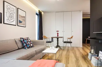 a living room with a couch and a table at Set-up Design in Sofia
