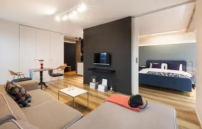 a living room with a bed and a couch at Set-up Design in Sofia