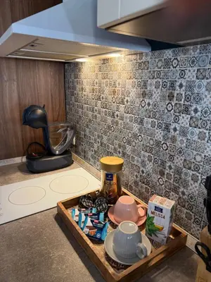 a kitchen with a tray of food on a counter at Momenti & Colori Studios in Sofia