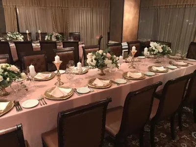 a long table in a room with tables and chairs at Apartment Аlex in Grand Monastery Pamporovo in Pamporovo
