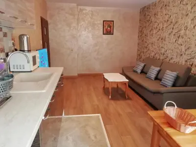 a small living room with a couch and a table at Apartment Lagera 55 in Sofia