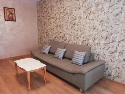 a living room with a couch and a table at Apartment Lagera 55 in Sofia