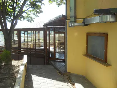 an outside view of a building with a door open at Hotel Orient in Blagoevgrad