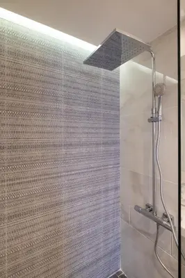 a shower in a bathroom with a glass wall at Vitosha Blvd Luxury 2-Bedroom, 2-Bathroom with Balcony in Sofia