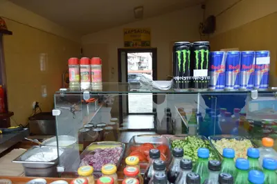 a kitchen with a counter with alot of food at Hotel Dumanov in Bansko