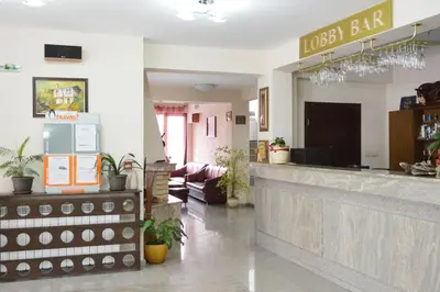 a lobby of a restaurant with a lobby bar at Hotel Dumanov in Bansko