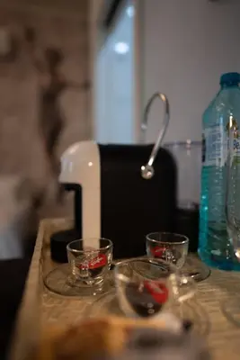 two glass bowls on a counter next to a mixer at 29A Guesthouse in Plovdiv