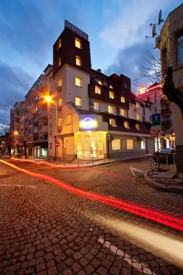 a building on a city street at night at Hotel Cheap - Smart choice - Great value in Sofia