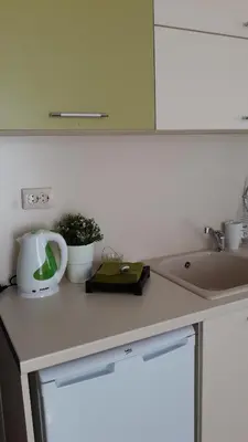 a kitchen counter top with a sink and a sink at Hotel39 in Plovdiv