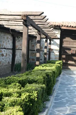 a row of hedges in front of a house at Djudjeva Kyshta Hotel in Panagyurishte