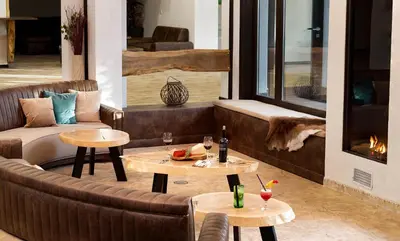 a living room with a couch and two tables at Wine & Spa Complex Starosel in Starosel