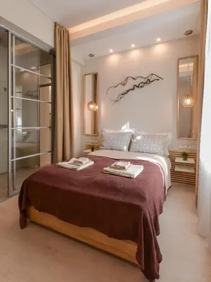 a bedroom with a large bed in a room at Sofia Dream Apartment - Premium One Bedroom on Ekzarh Yosif by Flat Mаnager in Sofia