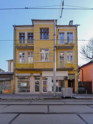 a yellow building on the corner of a street at Chic 1BR with Terrace in Sofia City Center by Flat Mаnager in Sofia