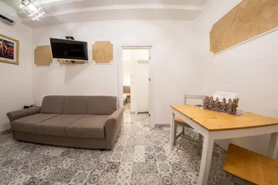 a living room with a couch and a table at Sofia Pearl Life Apartment - No Window Apartment in Sofia