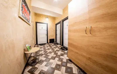 a hallway with a tiled floor in a house at Sofia Pearl Life Apartment - No Window Apartment in Sofia