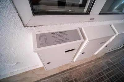 a door in a wall with a window in a room at Sofia Pearl Life Apartment - No Window Apartment in Sofia