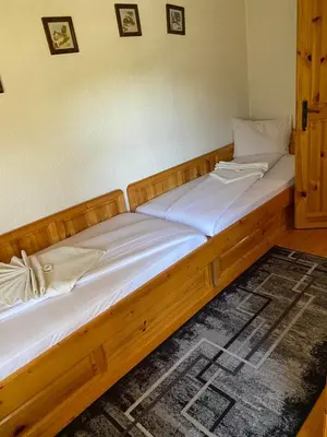 a pair of beds in a room with at вила Здравец in Yagodina