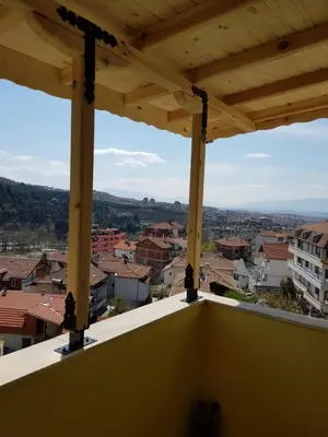 a view of a city from the balcony of a building at United Apartments 2 in Sandanski