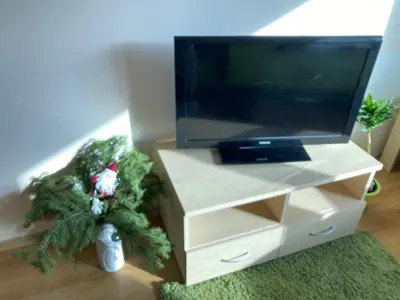 a living room with a tv and a christmas tree at Cedar Lodge 3/4 Apartment Paradise in Bansko