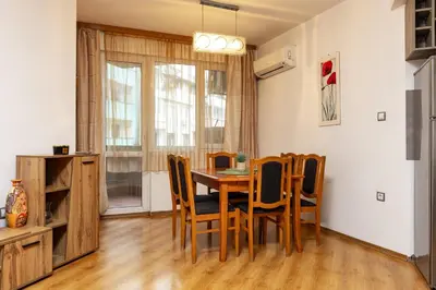 a dining room with a table and chairs at GLORIOUS - 2-Bedroom apartment near Youth Hill by Flat Mаnager in Plovdiv