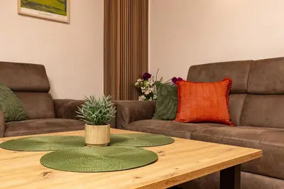 a living room with a table and a couch at GLORIOUS - 2-Bedroom apartment near Youth Hill by Flat Mаnager in Plovdiv