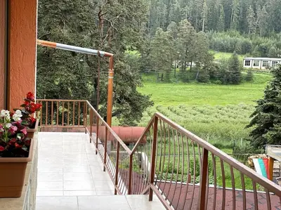 a balcony with a view of a green field at Vila Katerina in Yundola